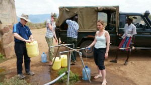 We fill up water jugs to bring back to camp for bathing.