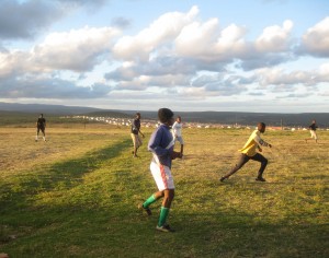This is the field where we train. The dent in the middle is very dangerous. We see this as a risk but we like to play here because the other fields are flooded or have too much dust. - Mfundo Klaas